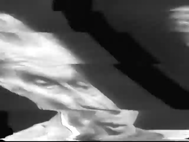 a distorted black and white television frame showing Aldous Huxley, taken from an interview in 1958